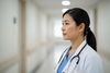 a female asian doctor middle aged profile face photo 